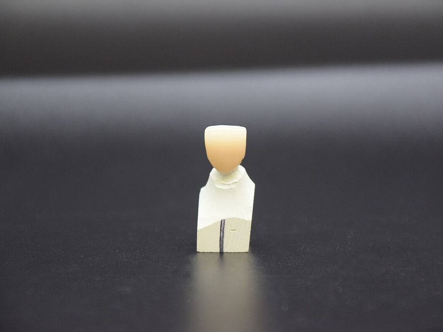 A zirconia dental crown on a mould